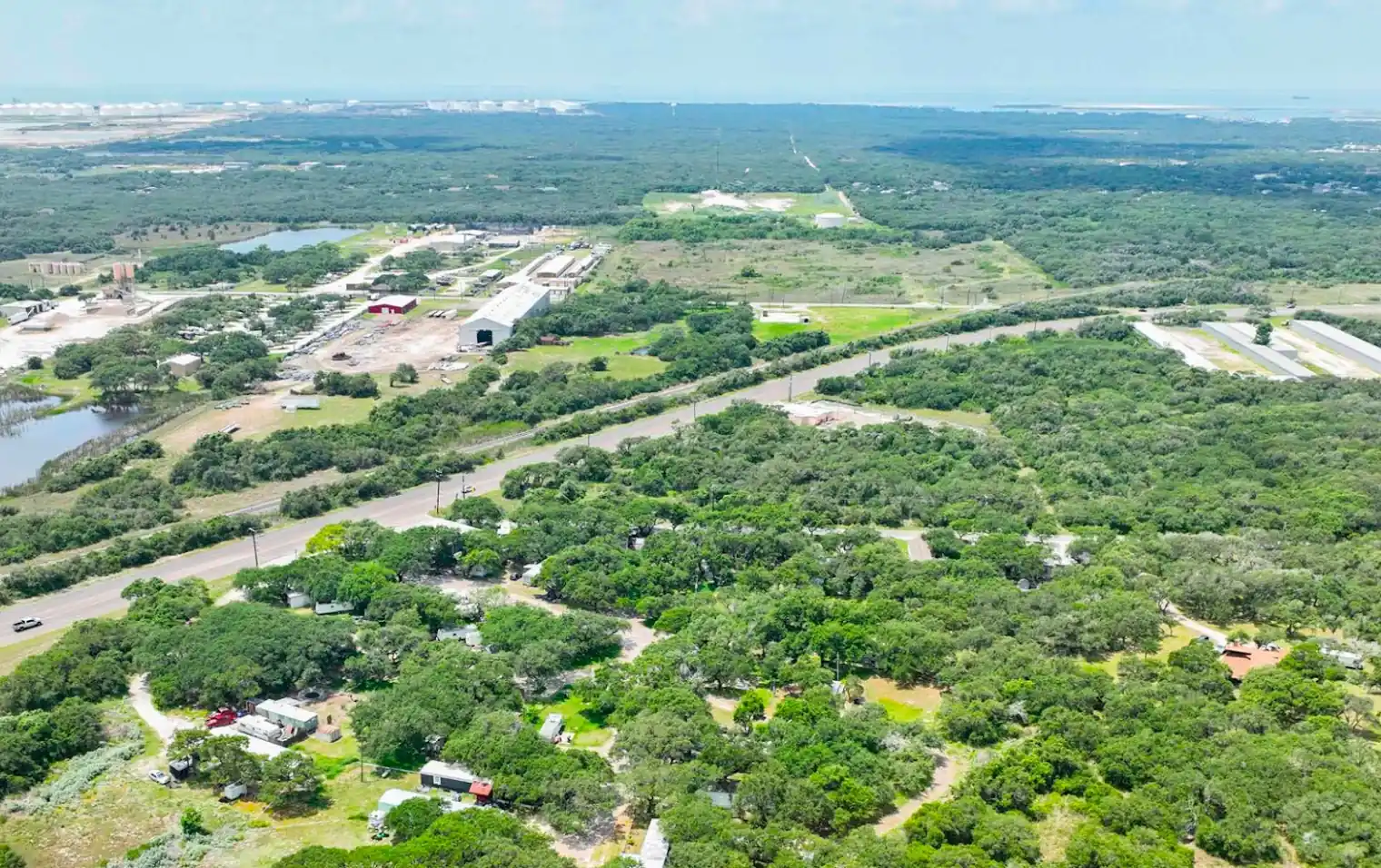 Live oak canopy over Indian Trails RV Park on Highway 361, Ingleside, Texas