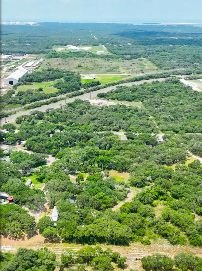 Wooded sites at Indian Trails RV Park seen from above, Ingleside, Texas